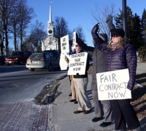 A small group of Shrewsbury teachers protest Wednesday near the public library | Photo: John Swinconeck